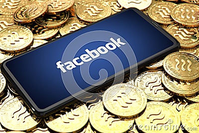 WROCLAW, POLAND - JUNE 20th, 2019: Facebook announces Libra cryptocurrency. Smartphone with facebook logo on the screen is laying Editorial Stock Photo