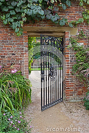 Wrought iron gate in garden Stock Photo