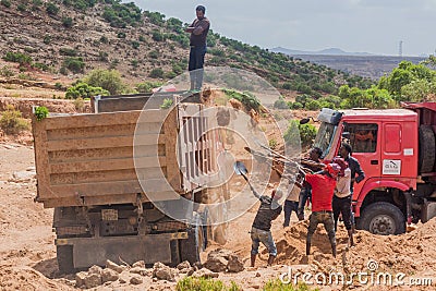 WUKRO, ETHIOPIA - MARCH 22, 2019: Local people loading sand into a truck near Wukro, Ethiop Editorial Stock Photo