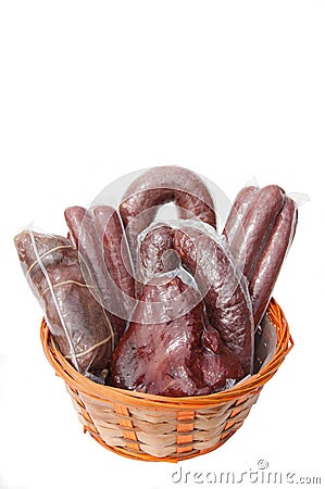 Wurst, ham in the basket isolated. A few sticks of sausage vacuum packed Stock Photo