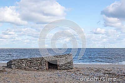 WW2 beach defence building uncovered by tidal surge Stock Photo