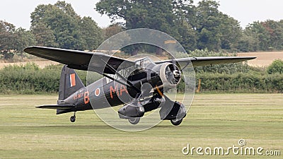 A WW2 vintage Westland Lysander lands on an airfield Editorial Stock Photo