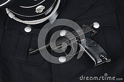 WWII era nazi german waffen SS black uniform 1930 year pattern and army handgun Editorial Stock Photo