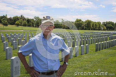 WWII veteran standing in cemetery Editorial Stock Photo