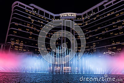 Wynn palace macau, nightitme fountain, water feature with large water jets Editorial Stock Photo