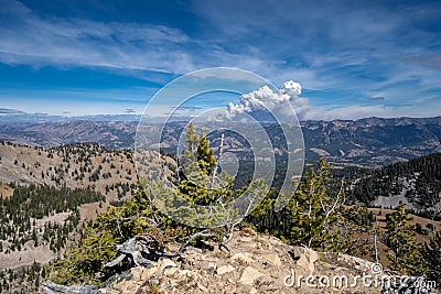 Wyoming mountain wildfire rages in the distance, view from a rid Stock Photo