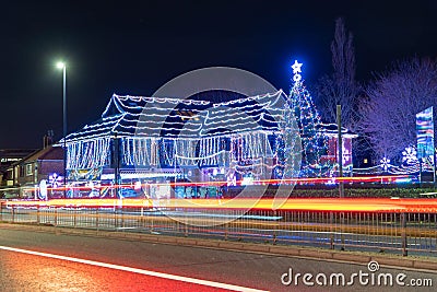 'Daft As a Brush' cancer patient transport charity's building lit up for Christmas Editorial Stock Photo