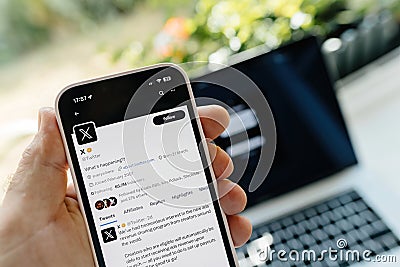 The X new Twitter app on a iPhone smartphone Editorial Stock Photo