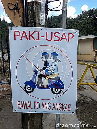 & x28;Please, backriding is not allowed& x29; signage in Philippines lockdown guidelines. Stock Photo