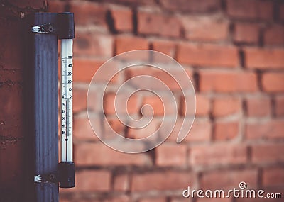 warm day outside with the thermometer reacing above Stock Photo