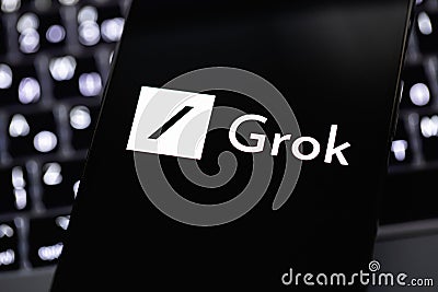 xAI Grok chatbot logo on a screen smartphone closeup. Grok (Grok xAI) is a new chatbot for X platform Editorial Stock Photo
