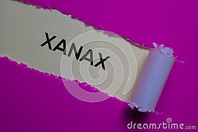 Xanax Text written in torn paper. Medical concept Stock Photo