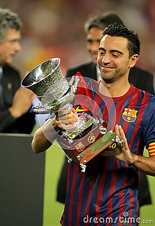 Xavi Hernandez of FC Barcelona holds up trophy Editorial Stock Photo