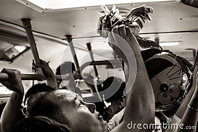 XI'AN, CHINA - MAY 14, 2018:Ticket Seller in a Crowded Bus in Ch Editorial Stock Photo