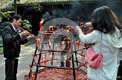 Xindu, China: People Lighting Incense Sticks Editorial Stock Photo