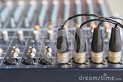 XLR connectors on the audio mixers. Stock Photo