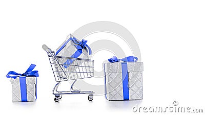 Xmas delivery. Trolley cart for supermarket with christmas or birthday gift box isolated on white background. Online valentine, Stock Photo