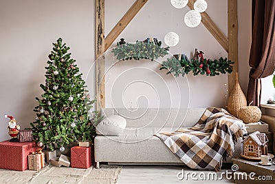 Xmas in morning living room. Sofa bed In christmas Interior. celebrate the new year and holidays. Christmas tree and Stock Photo