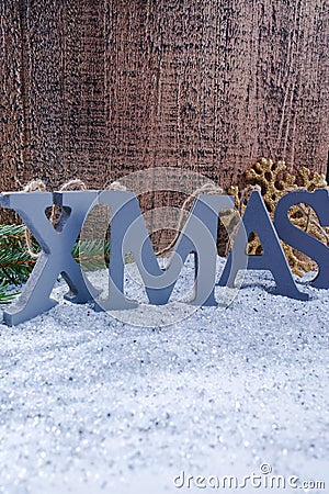 Xmas wooden letters and snowflake on shiny mirrored background, Stock Photo
