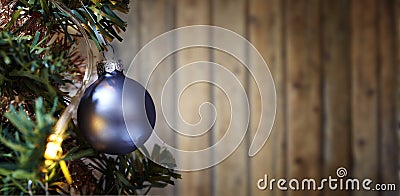 Xmass ball ornement tree against textured wooden wall Stock Photo