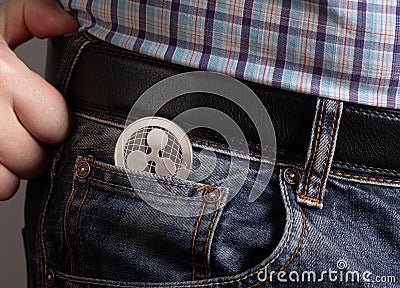 XRP coin in pocket jeans Editorial Stock Photo