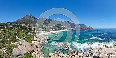 XXL aerial panoramic drone view of Camps Bay, an affluent suburb of Cape Town, South Africa. Stock Photo