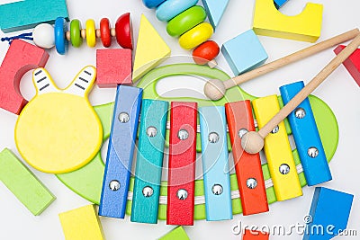 Xylophone and other wooden toys on a white background. flat lay Stock Photo