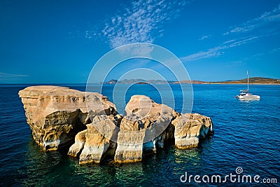 Yacht boat at Sarakiniko Beach in Aegean sea, Milos island , Greece Editorial Stock Photo