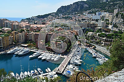 Yacht docks and mountains in Monaco harbour Stock Photo