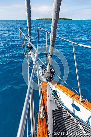 A yacht getting close to the Green Island in Great Coral Barrier, Cairns, Australia Stock Photo
