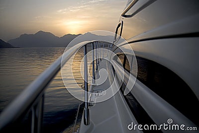 Yacht Heading To The Mountains Stock Photo