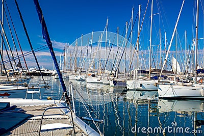 Yacht marina. Yacht pier. Many sailing boats are at the pier. Nice trip around the ocean Editorial Stock Photo