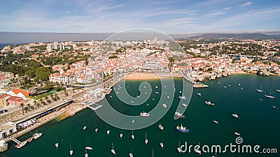 Yacht near beautiful beach and marina of Cascais Portugal aerial view Editorial Stock Photo