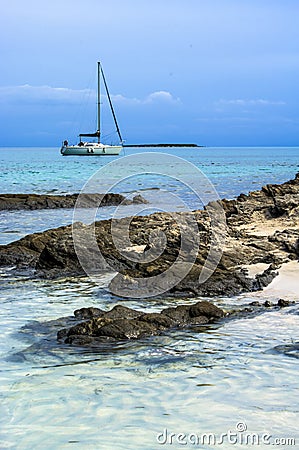 Yacht near Stantino Beach, Sardinia Stock Photo