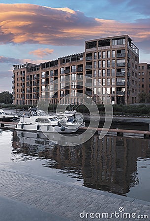 Yacht at the pier. City landscape. Sunset on the embankment after rain Editorial Stock Photo