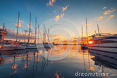 Yacht and sailboat harbor and scenic sunset over the sea. Yachts and boats on the coast Editorial Stock Photo