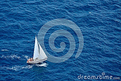 Yacht sailing in blue sea Stock Photo