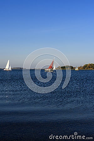 Yacht sailing on lake Stock Photo