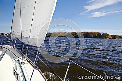 Yacht. Sailing on the lake in autumn sunny day. Stock Photo