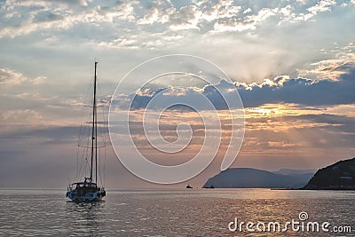Yacht at sea at sunset. Yachting, luxury Sailing theme Stock Photo