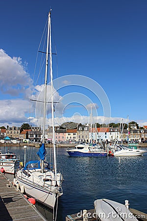 Yacht and small boats, Anstruther harbour, Fife Editorial Stock Photo