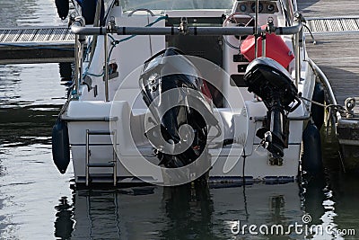 Yacht stern on with two outboards Stock Photo