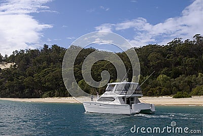 A yacht stops off at moreton island Stock Photo