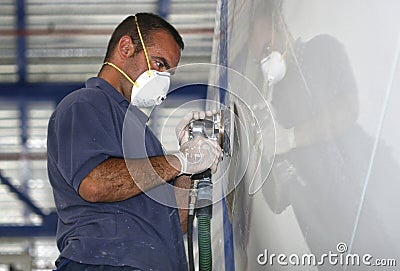 Yacht worker polishing hulk Editorial Stock Photo