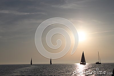 Yachting to sun Stock Photo