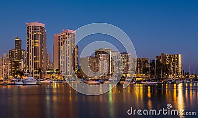 Yachts in Ala Moana harbor in Waikiki at night Stock Photo