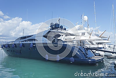 Yachts anchoring in seaside town in marina France Stock Photo