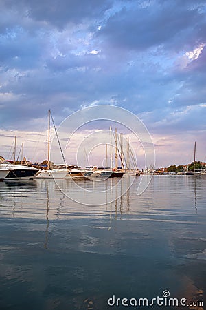 Yachts in the bay on the background of the evening sky Stock Photo