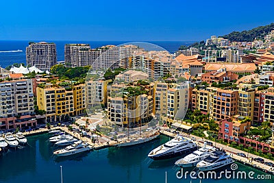 Yachts in bay near houses and hotels, Fontvielle, Monte-Carlo, Monaco, Cote d `Azur, French Riviera Editorial Stock Photo