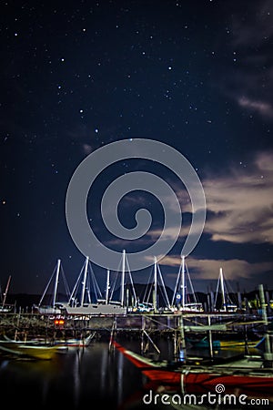 Yachts on the beach under the starry sky Editorial Stock Photo